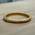 GOLD RIVA HAMMERED BANGLE