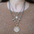 VINTAGE SILVER MINI COIN AND HORSEBIT NECKLACE